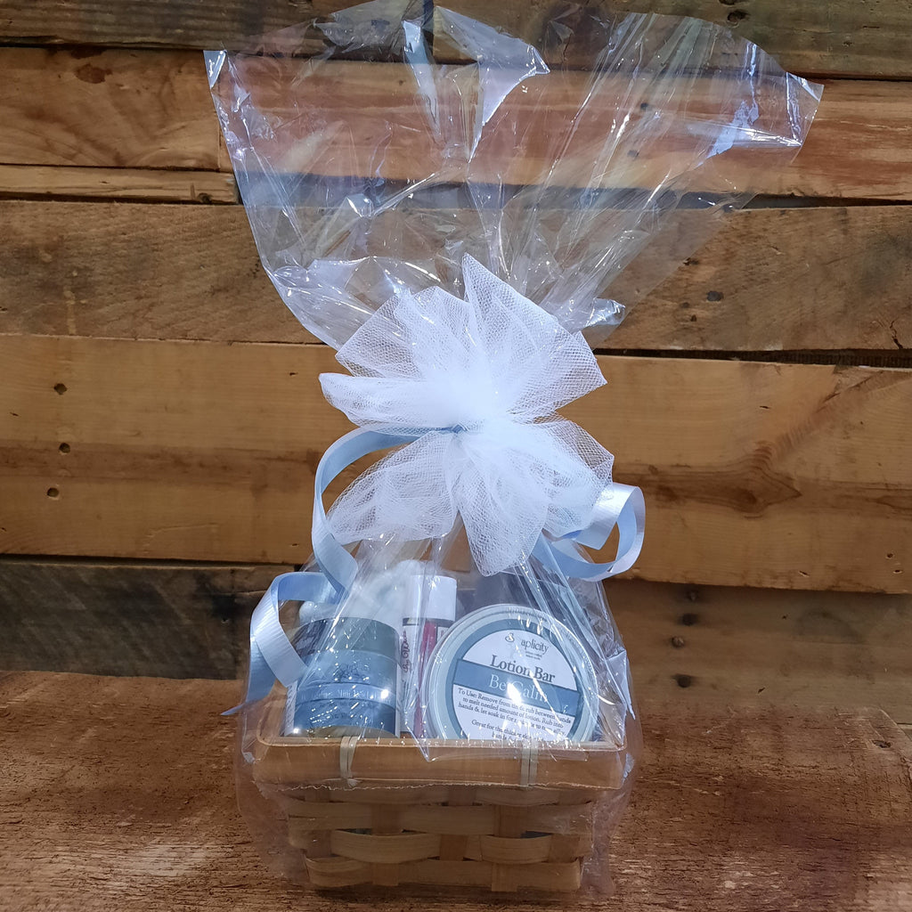 Small scented gift set basket in clear wrap with white tulle and blue ribbon