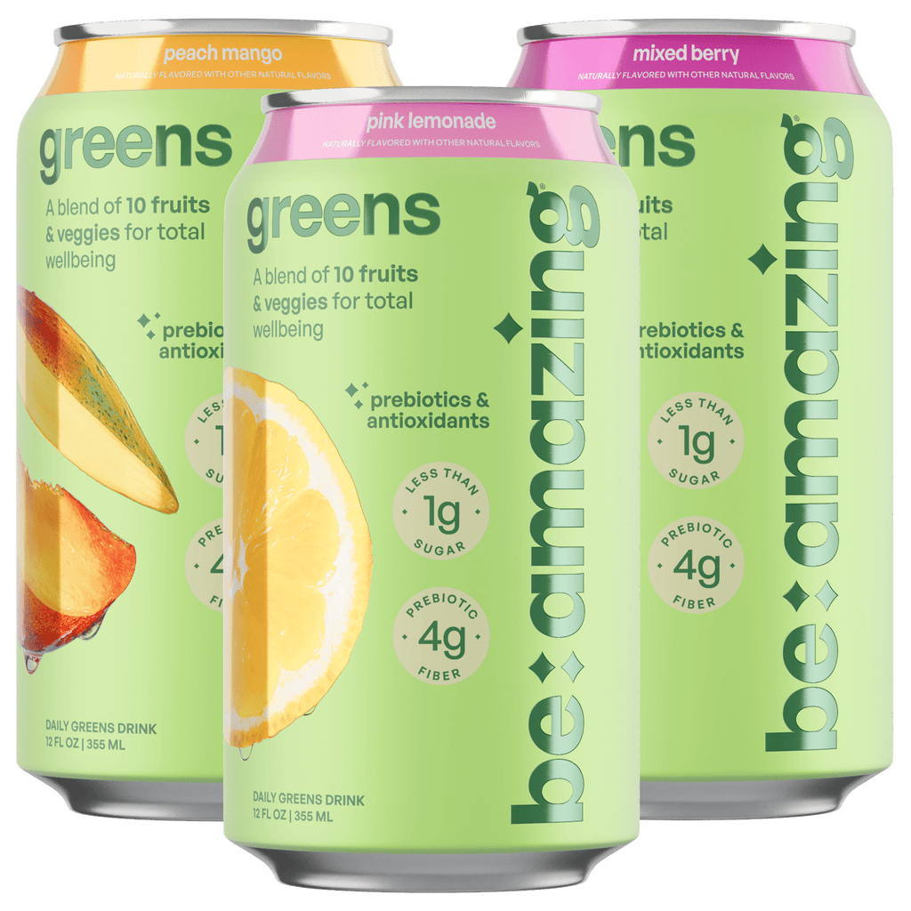 Assorted greens drink cans: peach mango, pink lemonade, and mixed berry varieties