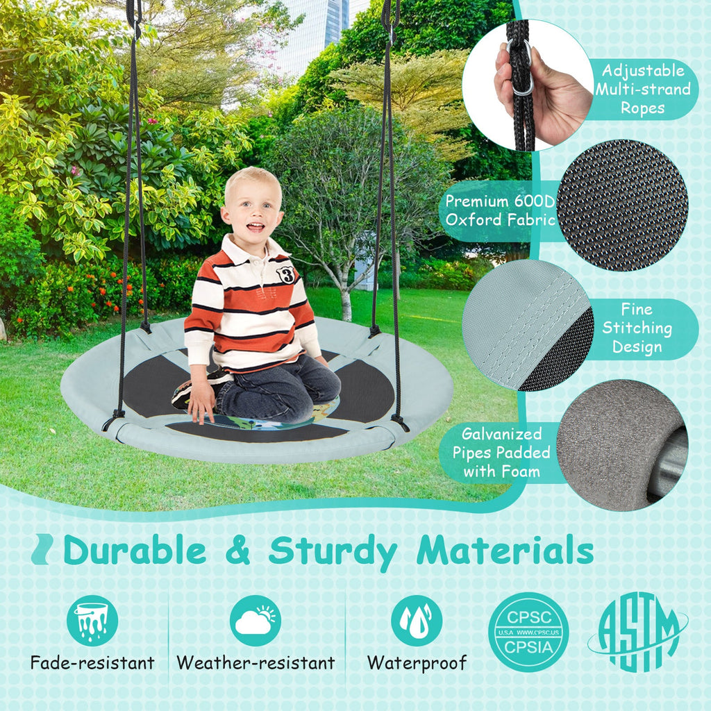 Saucer tree swing with light aqua fabric seat, black center graphic, and adjustable multi-stand ropes