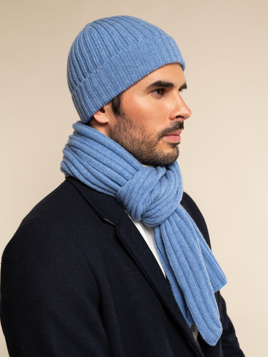Unisex light blue ribbed beanie worn with a matching knit scarf