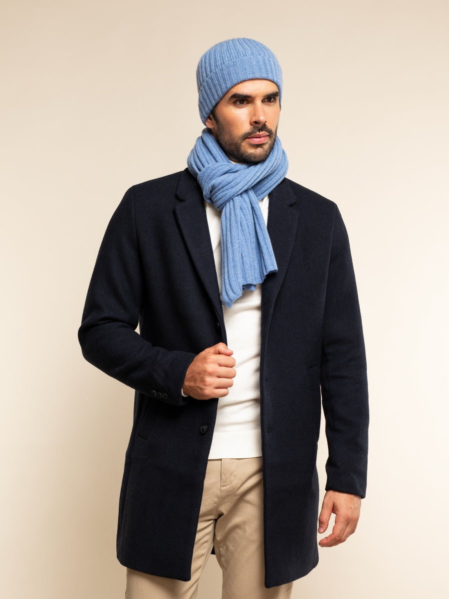 Man wearing light blue ribbed beanie with matching scarf