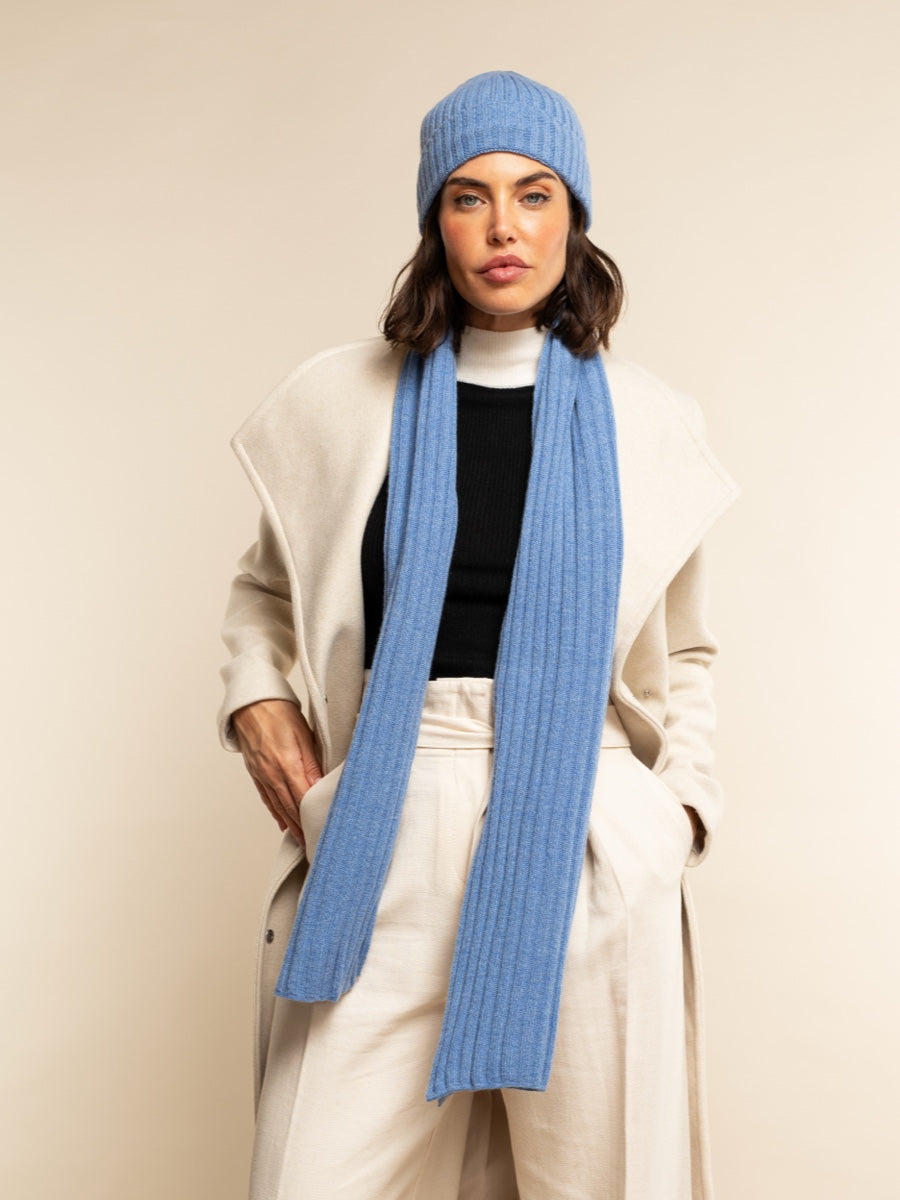 Light blue ribbed beanie and matching scarf with cream outerwear
