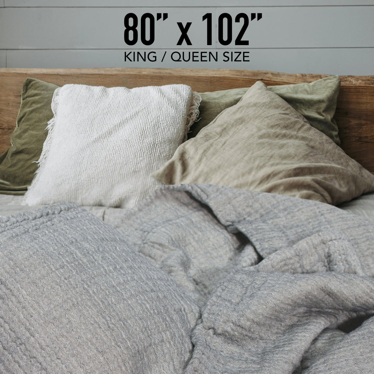 Reversible muslin coverlet with grey and light ivory sides, quilted texture, twin pillows