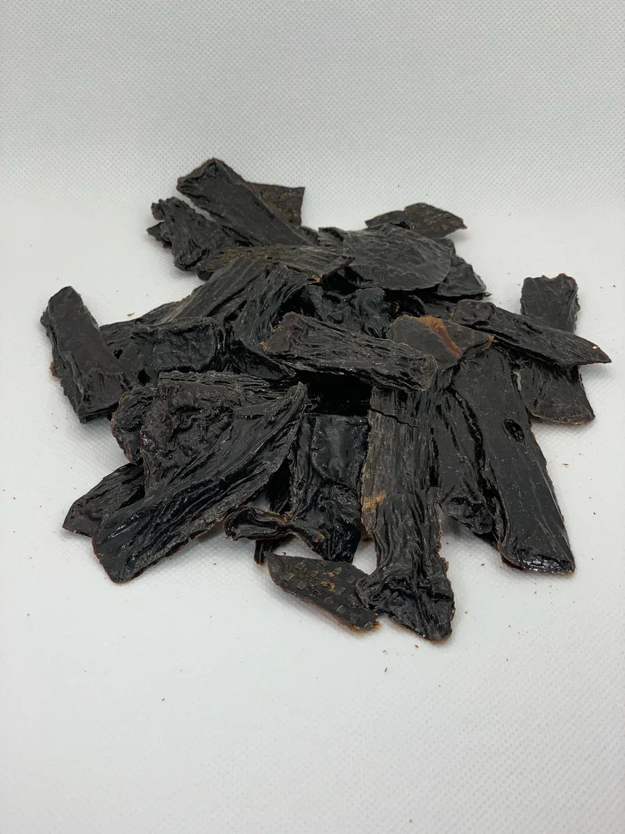 Beef liver jerky strips for dogs, dark dried strips pile