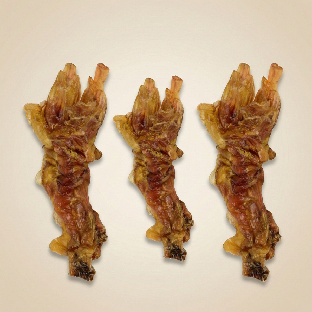 Three beef tendon chews, golden-brown dried tendon strips