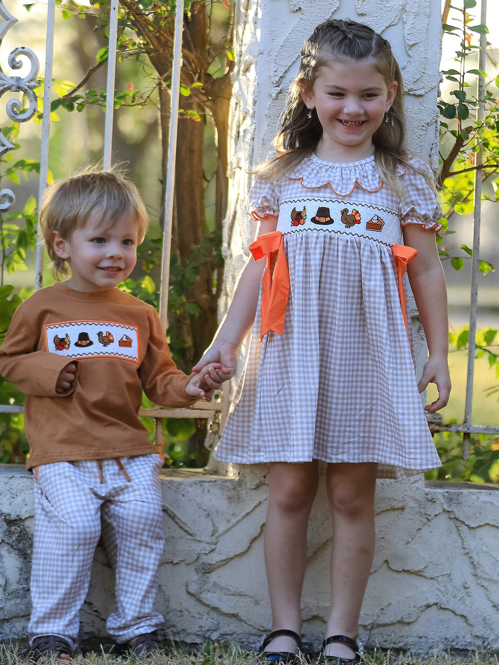 Girls orange-bow gingham Thanksgiving dress with embroidered border