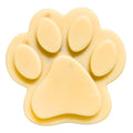Single paw-shaped goat milk soap bar, light cream color with oval toes