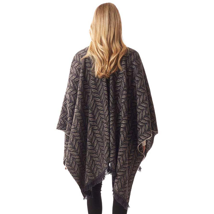 Leaf patterned poncho shawl wrap, black, back view with fringed hem