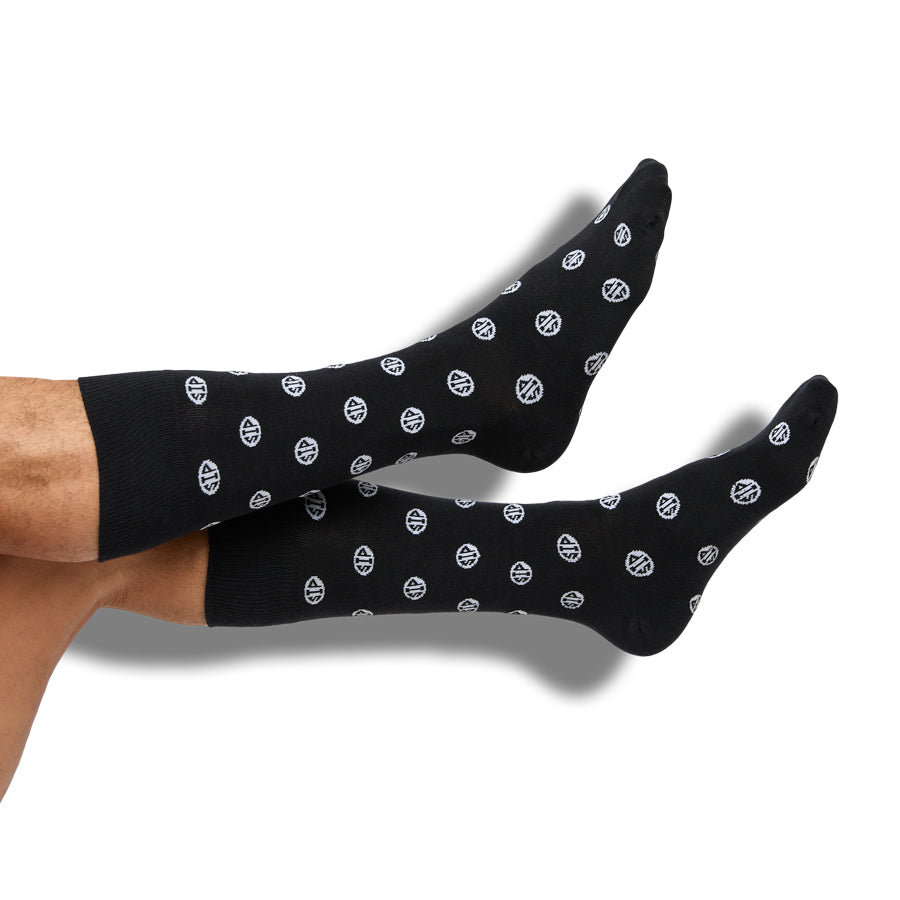 Black crew socks with repeating white circular logos