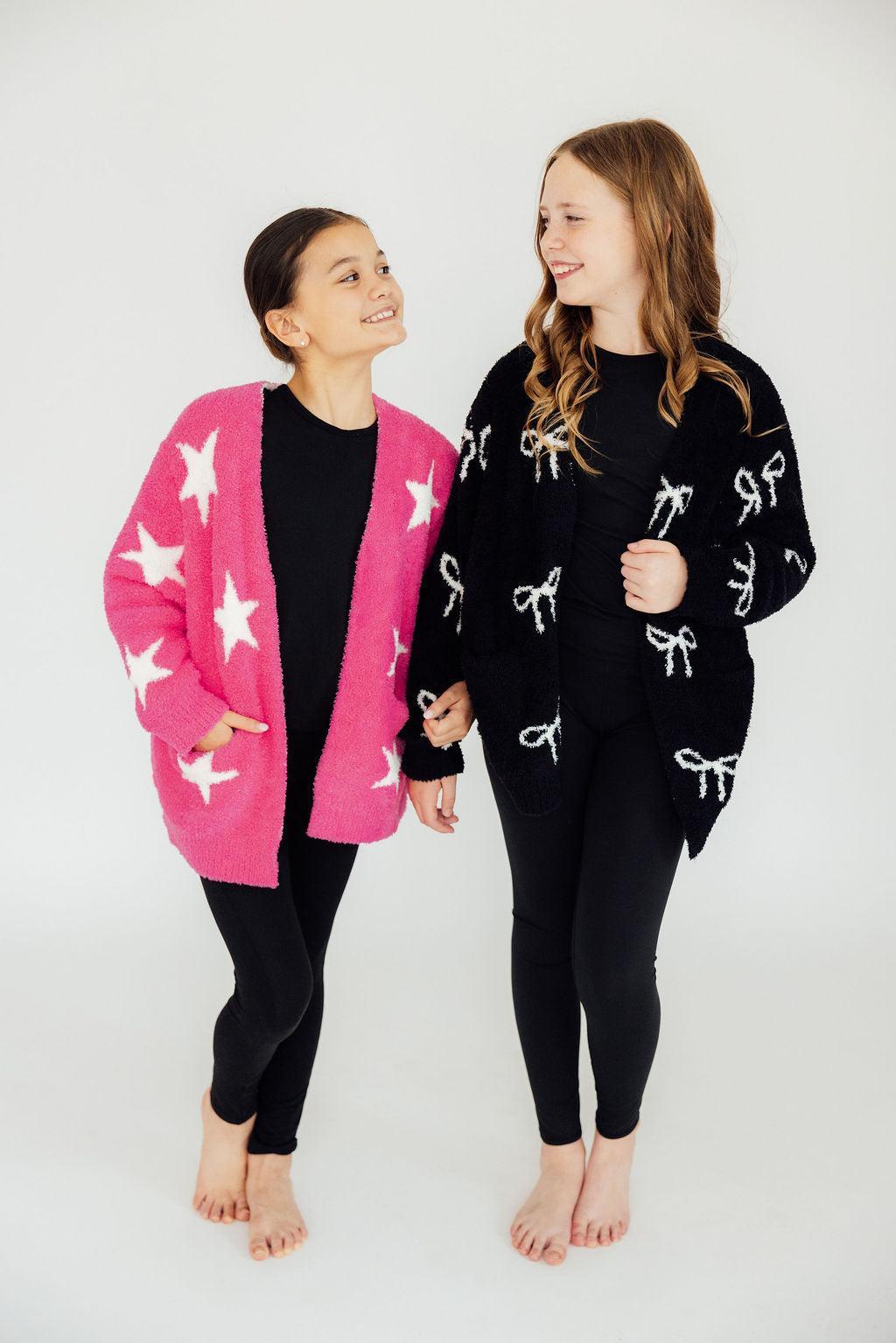 Black bow-pattern cardigan with long sleeves and button-front, crew neck