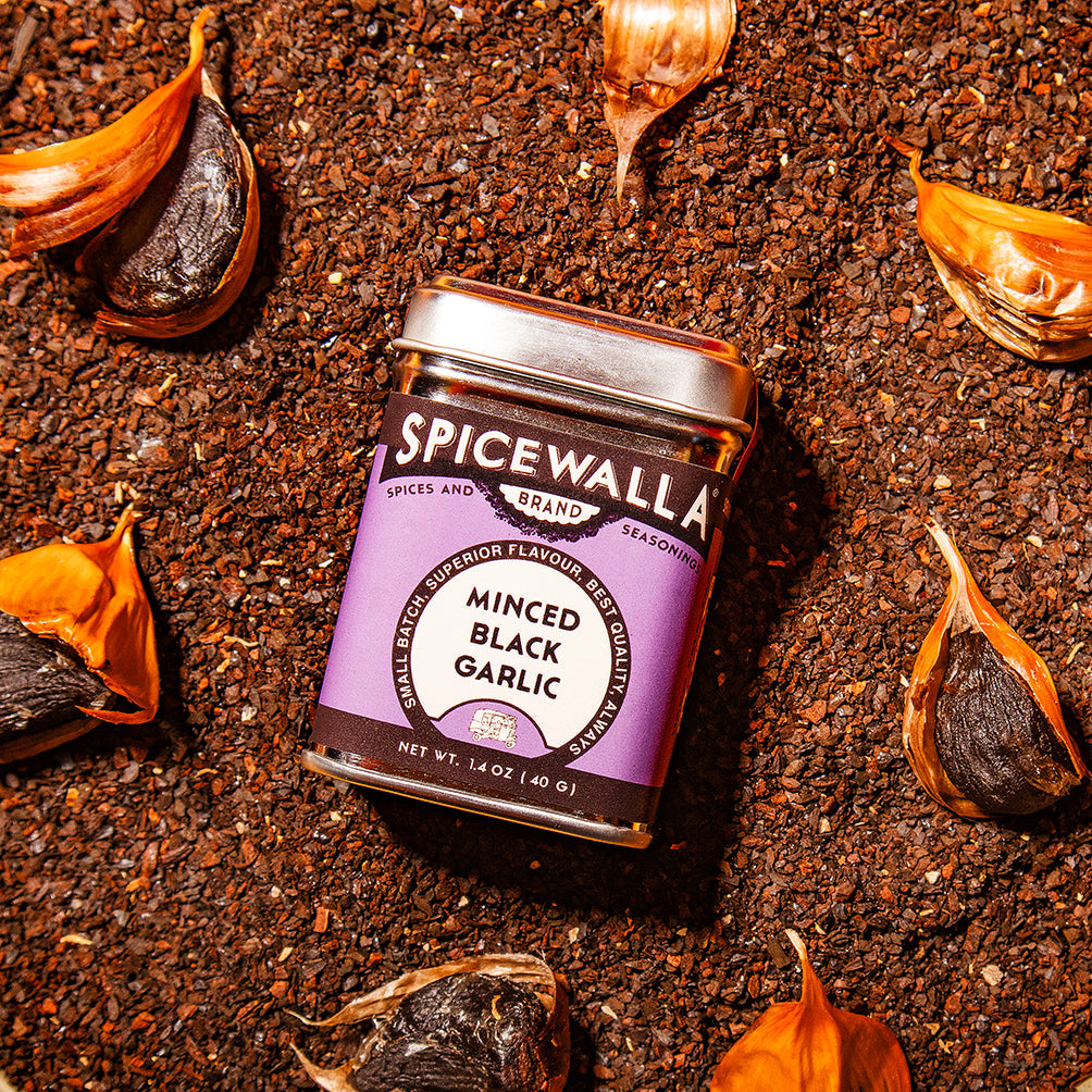 Spicewala minced black garlic seasoning jar with purple label and silver lid