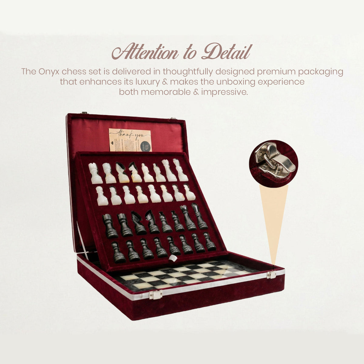 Chess set in open box with dark and light pieces on fitted trays
