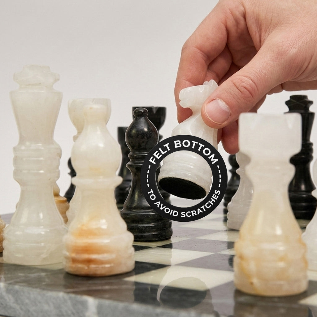 Onyx chess pieces with a hand placing a light piece on a black-and-white board