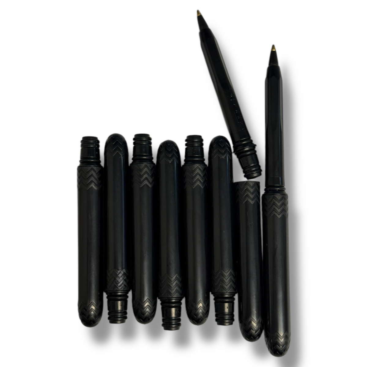 Pocket pen pack, lineup of black slim pens with textured chevron barrels