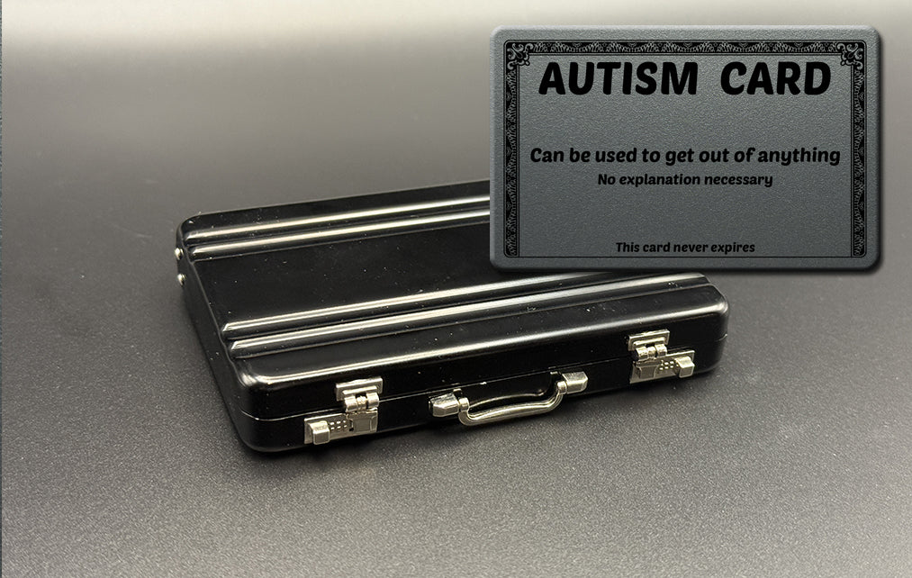 Black mini briefcase with 'AUTISM CARD' insert card, gray frame.