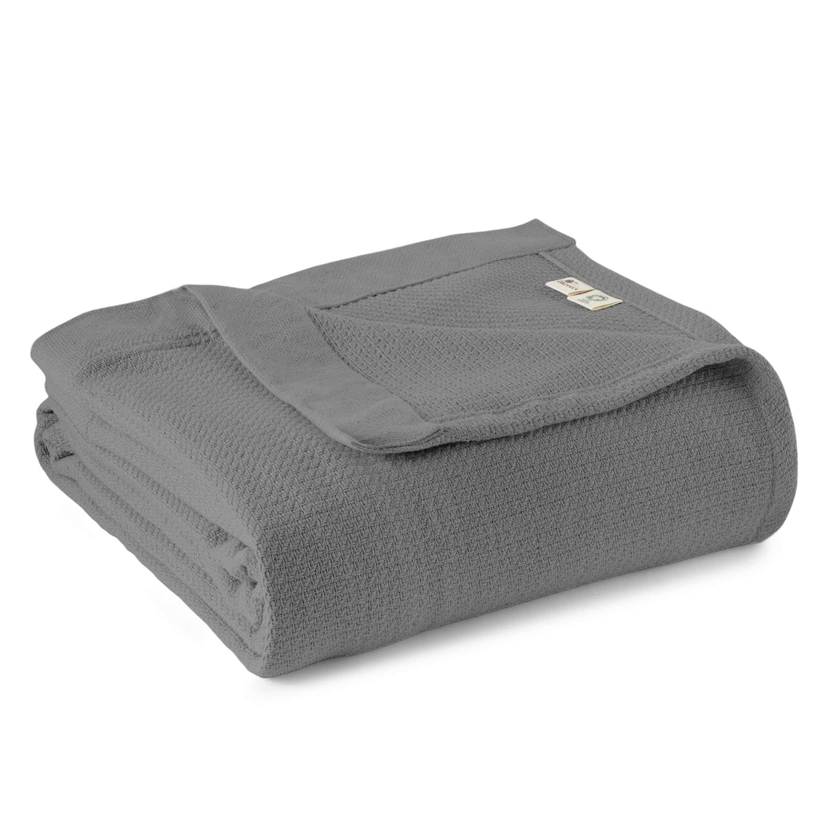 Grey woven blanket folded with textured weave and stitched edge.