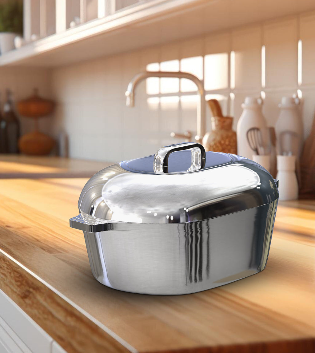 Oval Dutch oven with silver domed lid and side handles