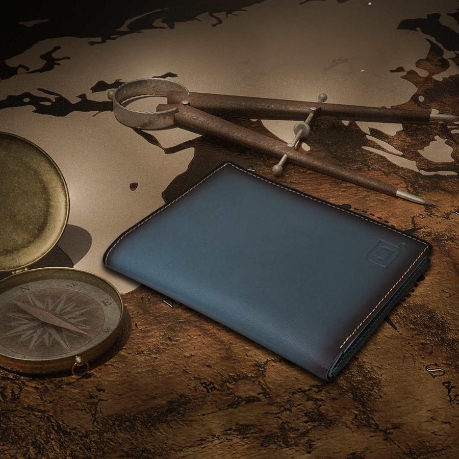 Dark teal blue leather passport wallet, closed with stitched border and embossed logo