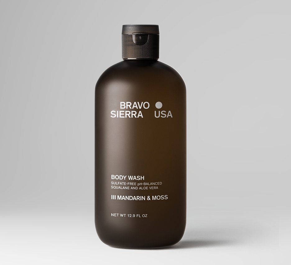 Dark brown body wash bottle with black cap; Mandarin & Moss scent.