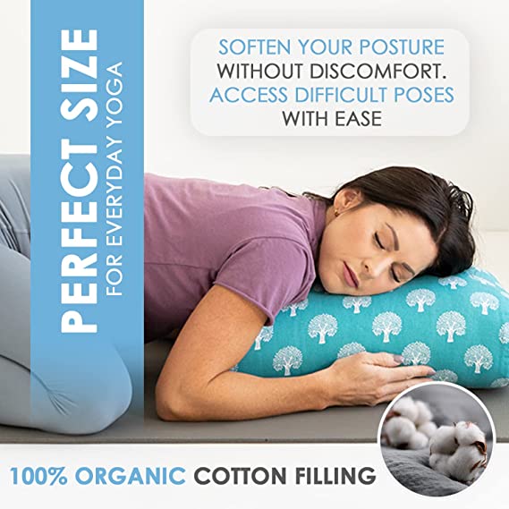 Teal elephant-pattern yoga bolster used under the head on a workout mat