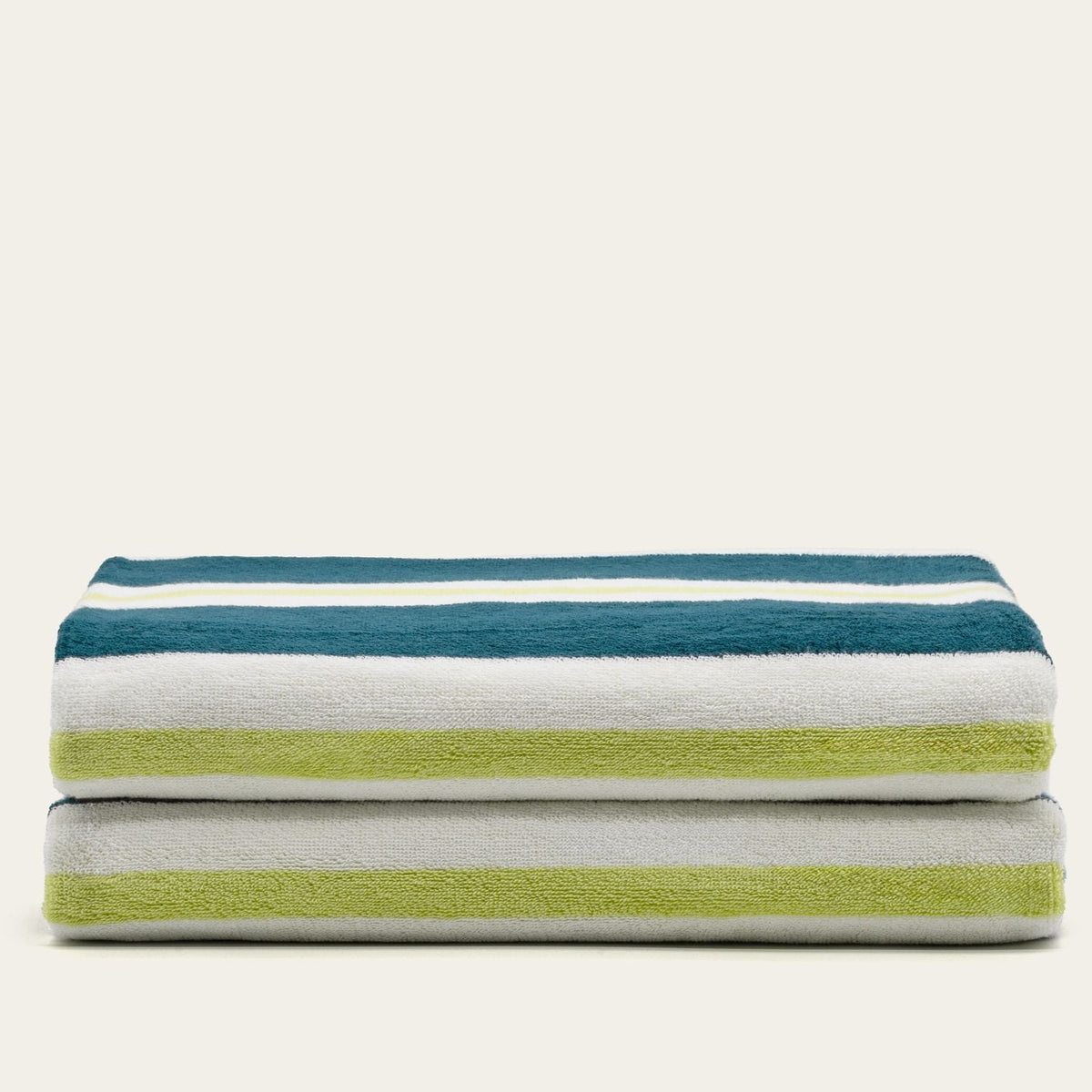 Cotton beach towel with teal, white, and lime-green horizontal stripes, folded