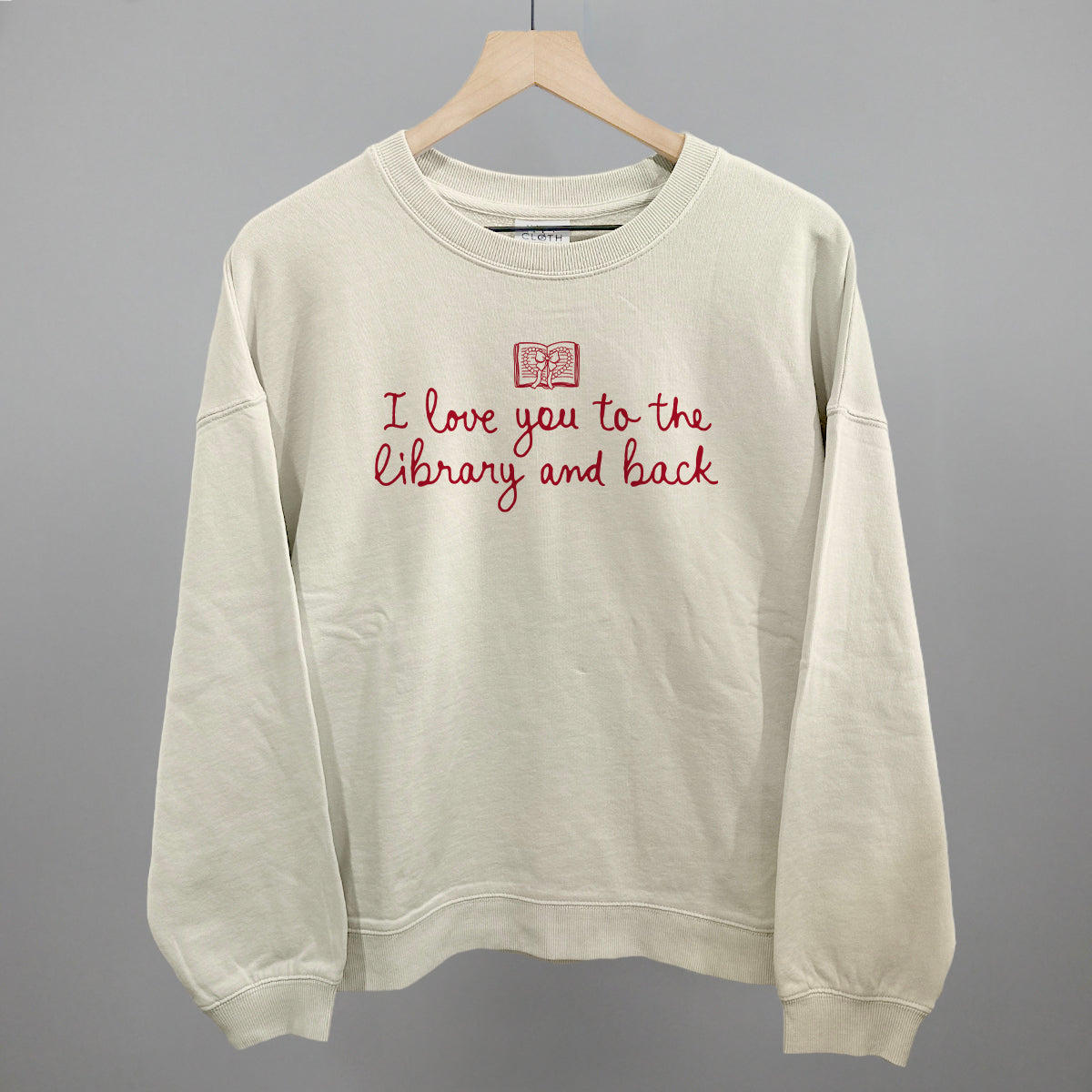 Light beige crewneck sweatshirt with red "I love you to the library and back" graphic