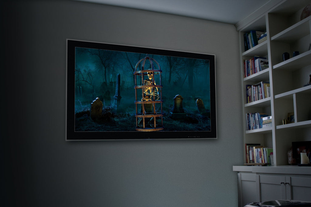 Halloween skeleton projection on wall with eerie outdoor scene