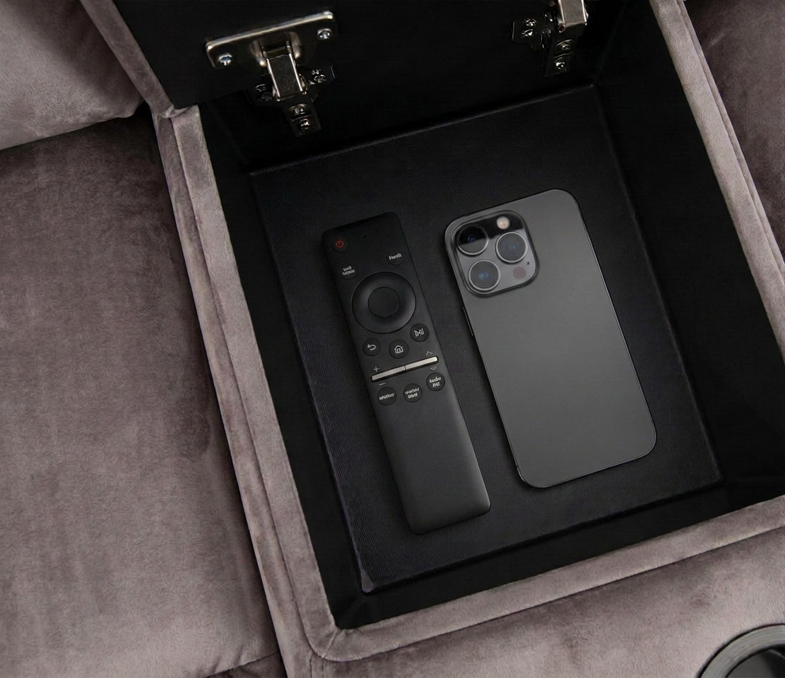 Recessed storage tray with remote control and smartphone inside on gray sectional