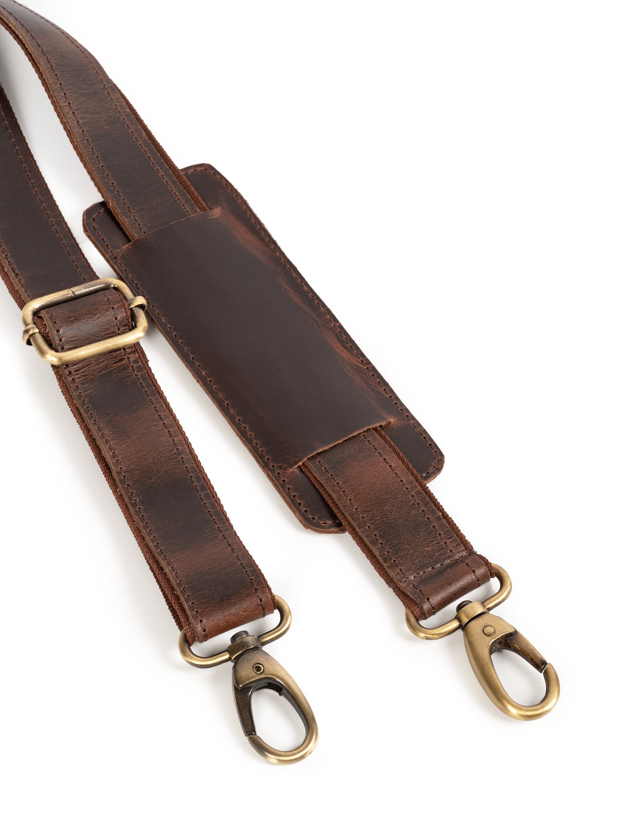 Brown leather shoulder strap ends with brass-tone O-rings and metal clips