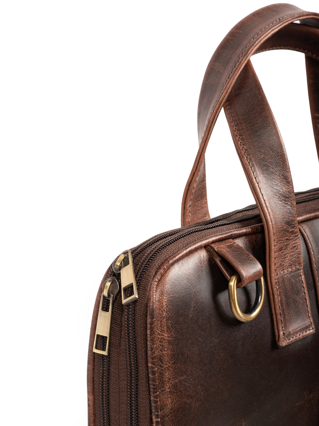 Brown leather briefcase close-up with zipper track and side pocket handle