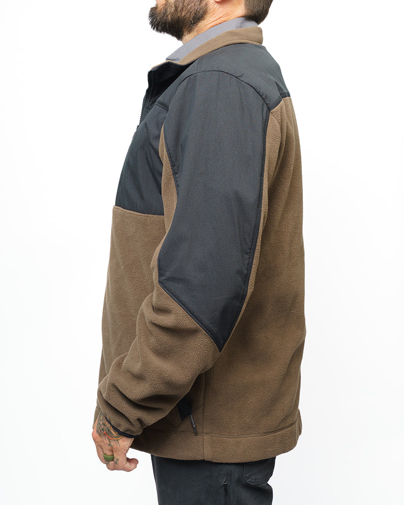 Side view of two-tone fleece zip-up jacket, brown body with dark charcoal sleeve panel.