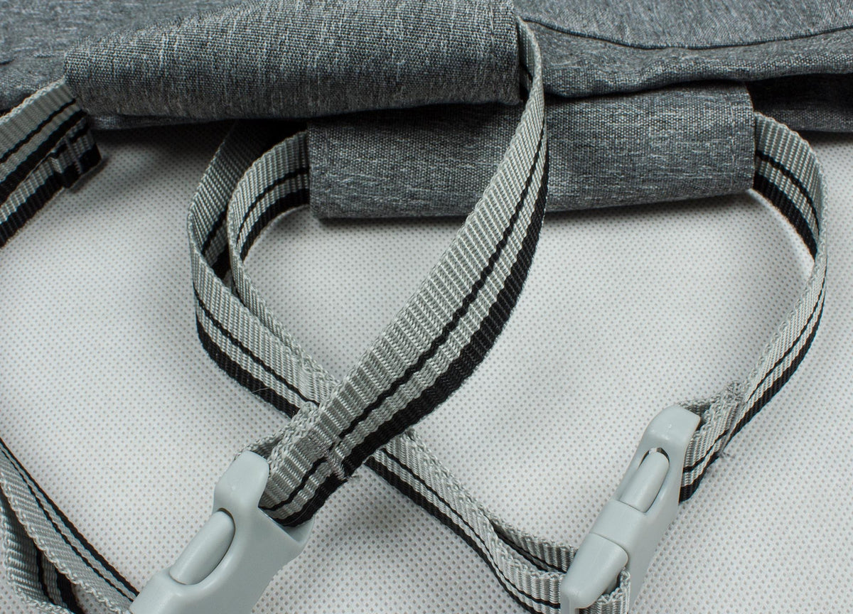 Close-up of grey cover straps and inner panel with textured mesh-like fabric