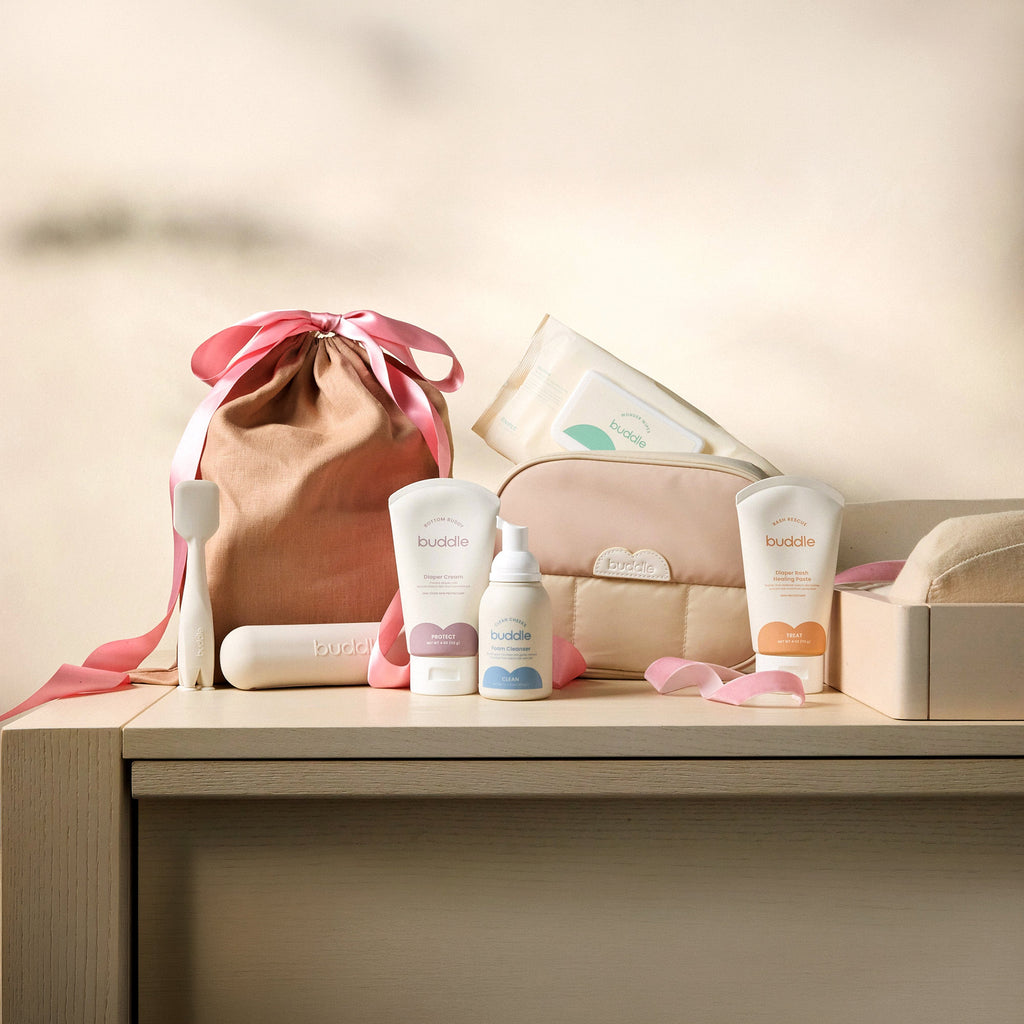 Diaper rash kit with drawstring pouch and buddle skincare bottles on a shelf