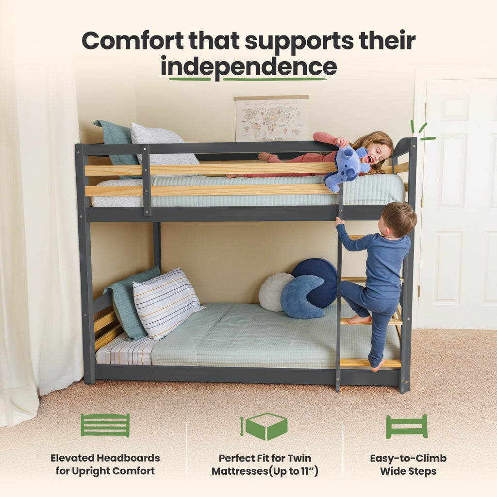 Gray twin-over-twin bunk bed with attached ladder steps and protective rails.