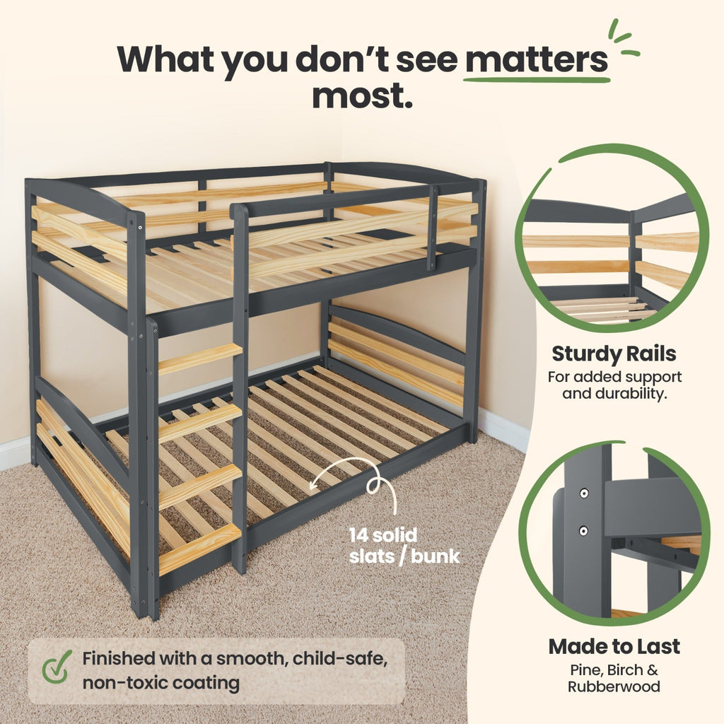Gray twin-over-twin bunk bed corner view with slatted frame and safety rails.