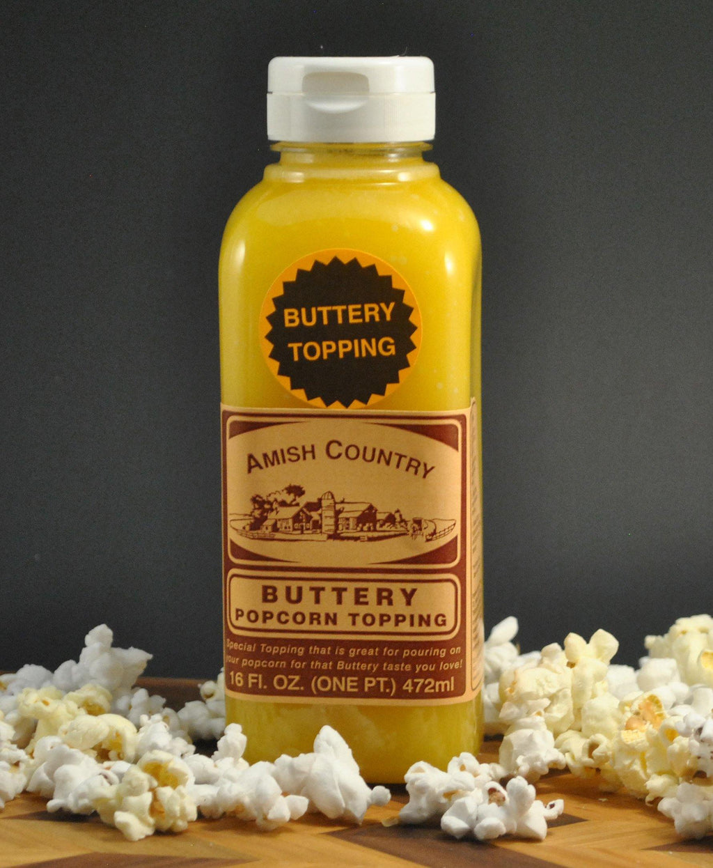 Buttery popcorn topping bottle with Amish Country label, 16 fl oz.