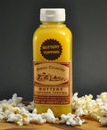 Buttery popcorn topping bottle with Amish Country label, 16 fl oz.