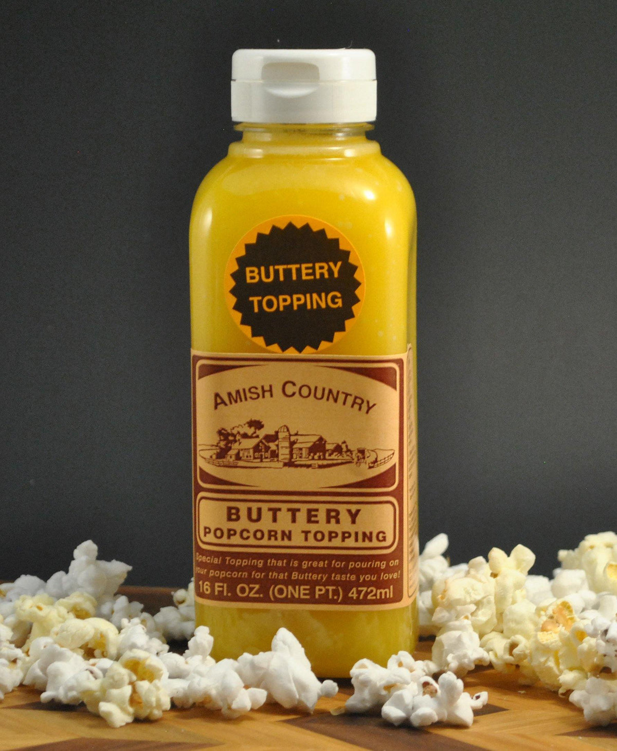 Buttery popcorn topping bottle with Amish Country label, 16 fl oz.