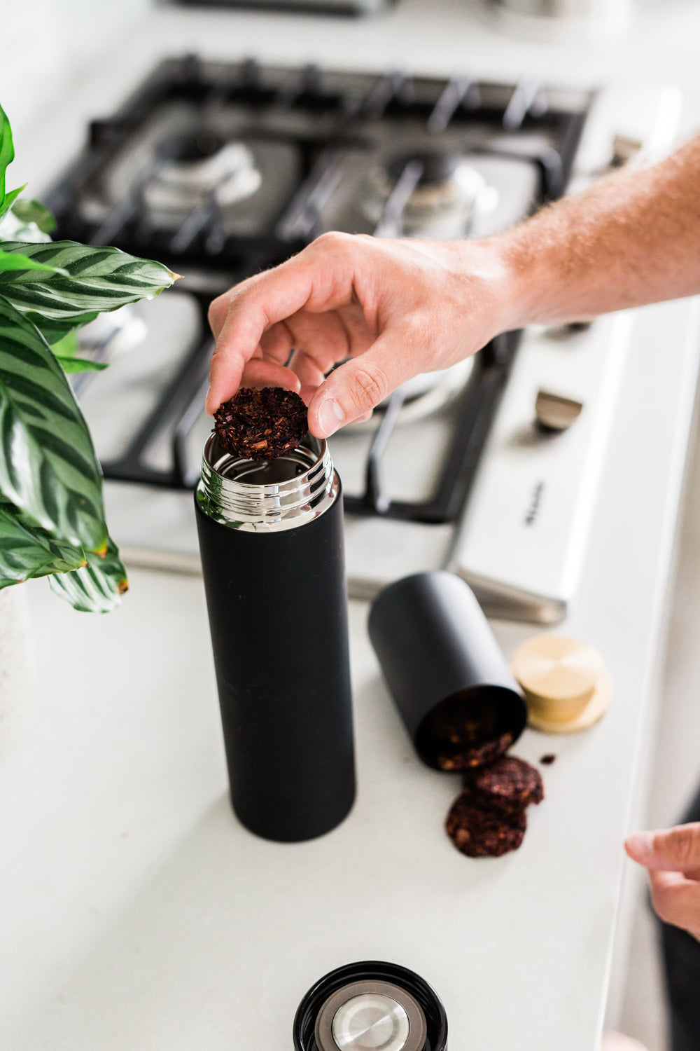 Snow Maple No. 41 loose tea being placed into a tea infuser