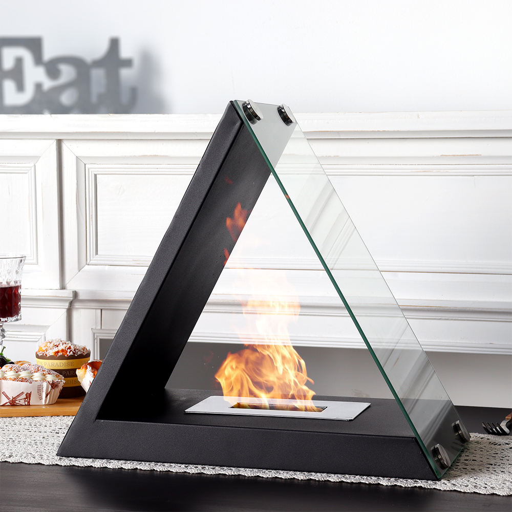 Black triangular tabletop alcohol fireplace with front tray, glass side, and flame