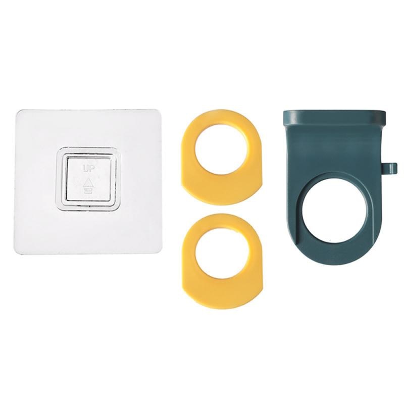 Self-adhesive shower bottle holder components: white mount, yellow tapes, dark teal rack