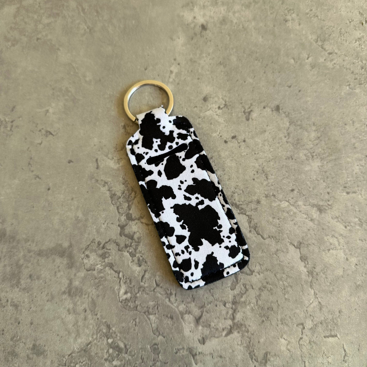 Black and white cow print chapstick holder keychain