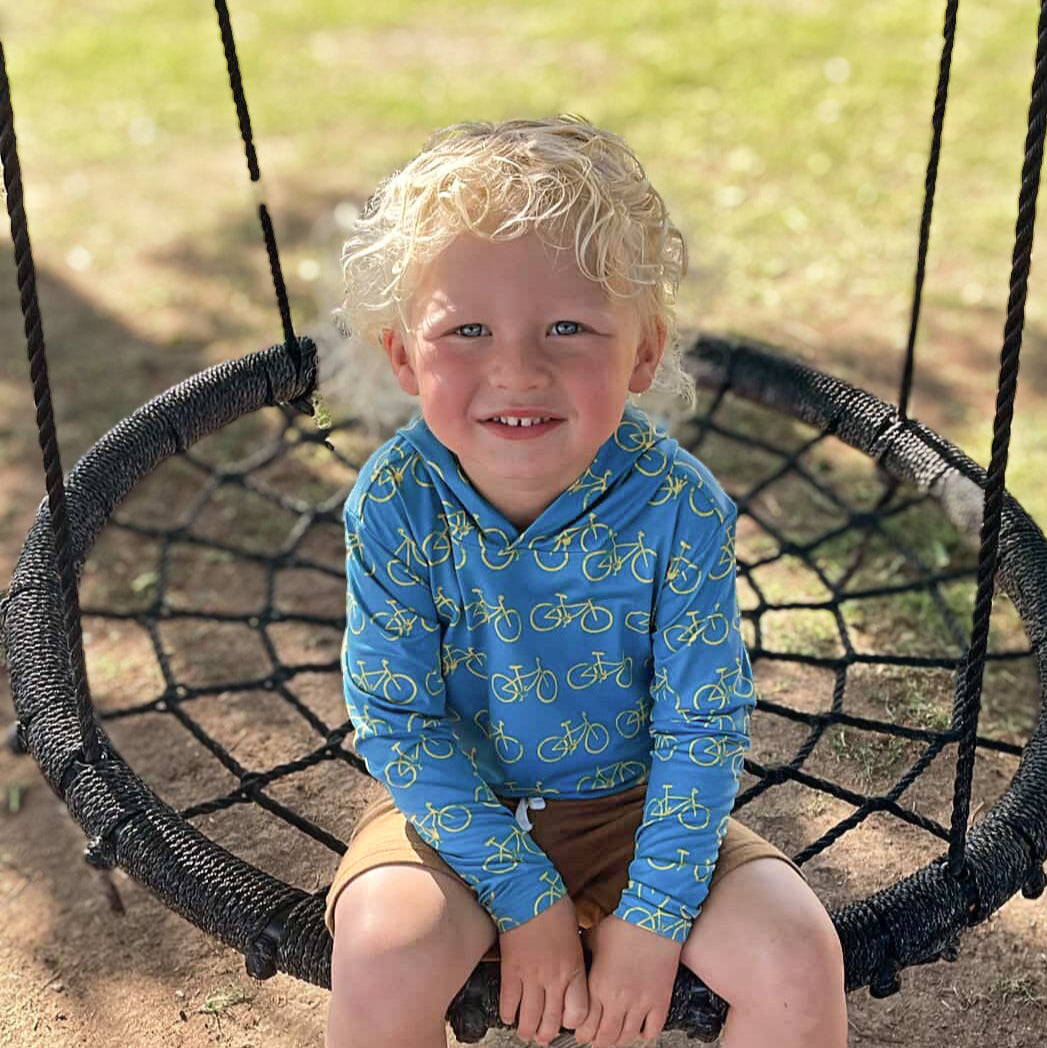 Kids blue long-sleeve sun hoodie with bicycle pattern and hood