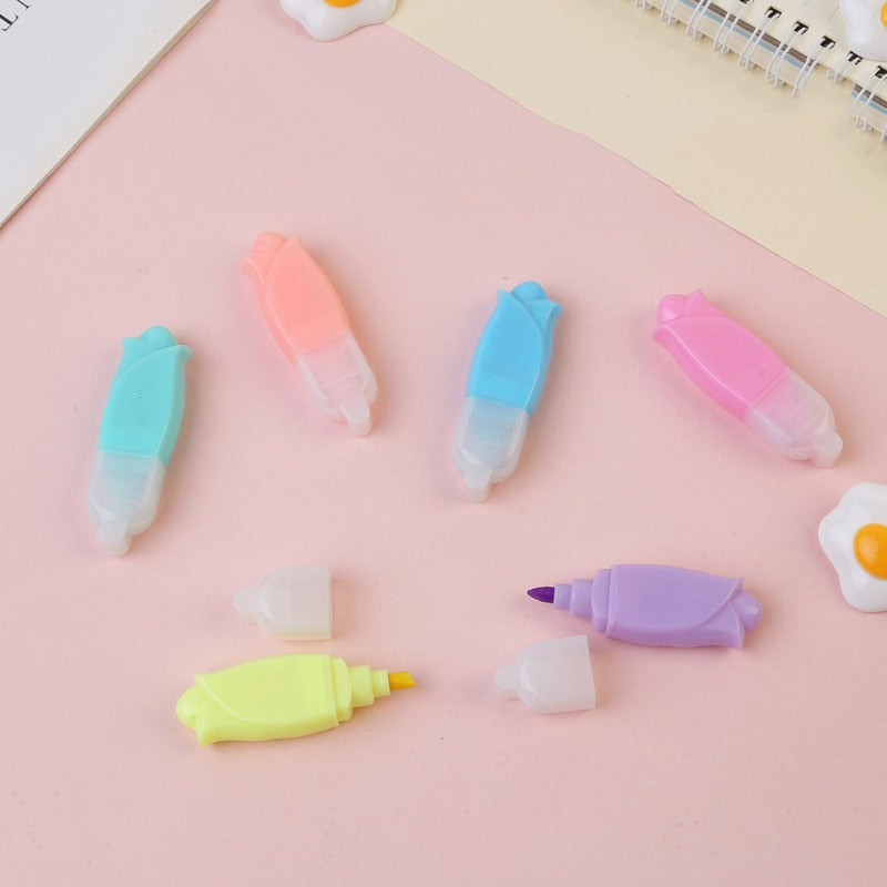 Assorted pastel mini highlighter markers with chisel tips and capsule shapes.