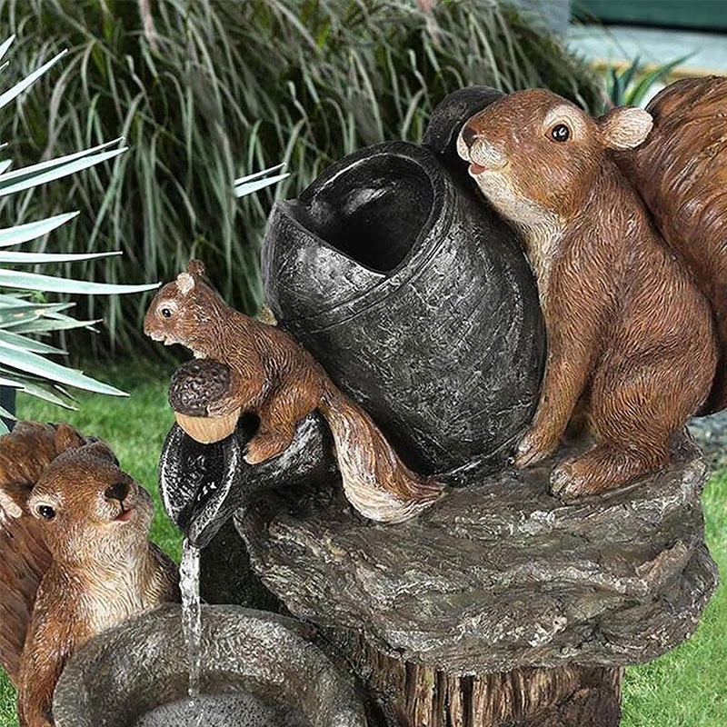 Resin squirrel garden fountain detail with brown squirrels on water spout