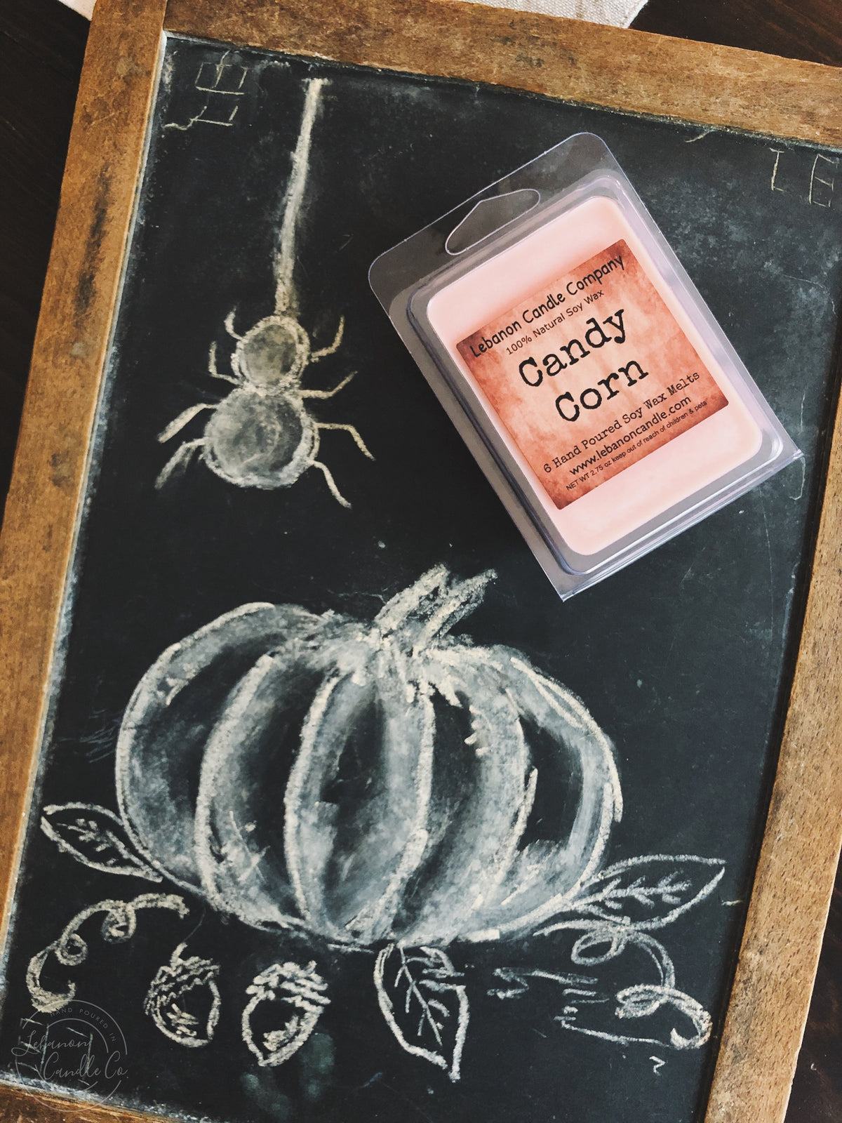 Candy corn wax melt in clear box, pale orange soy wax bar with label