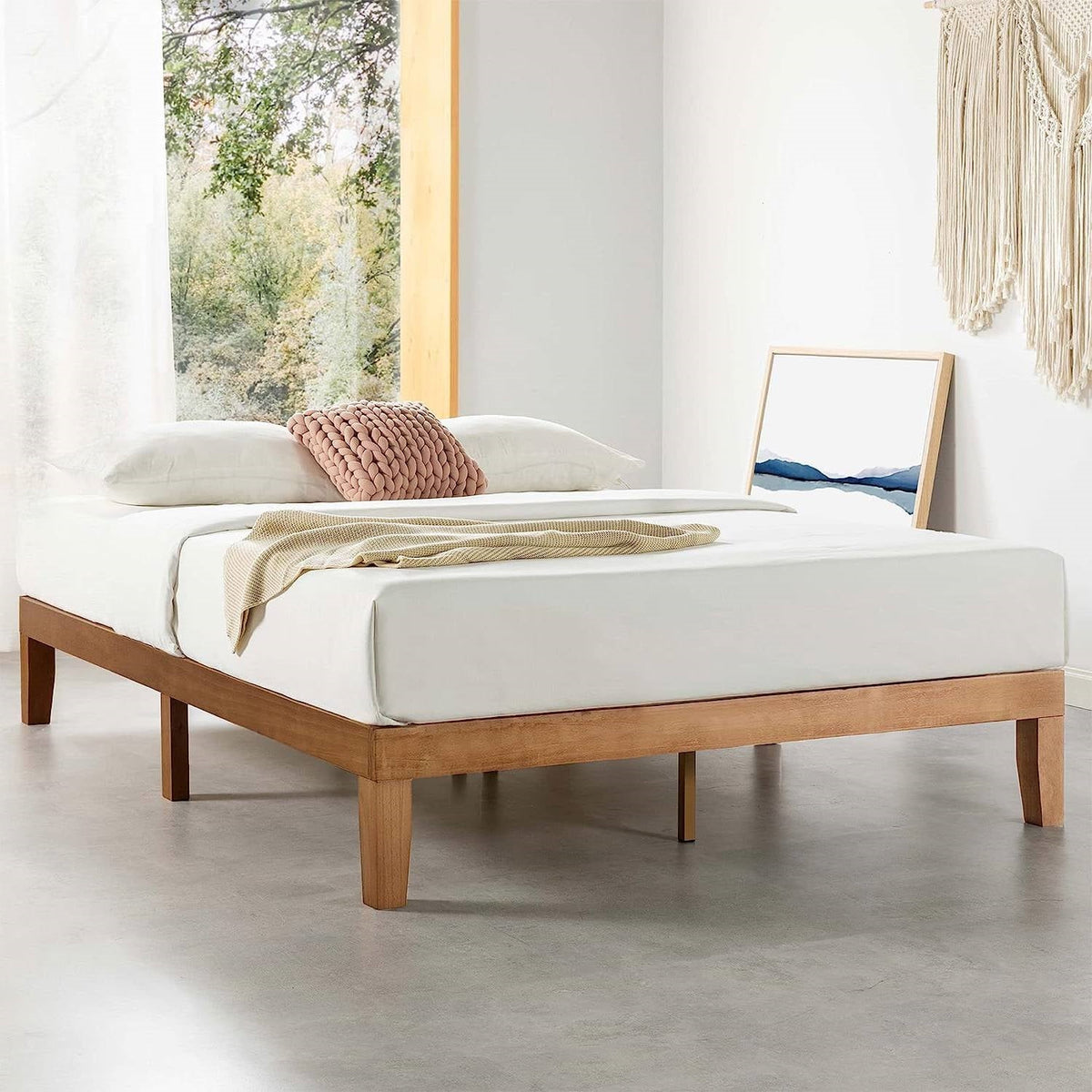 Natural wood platform bed frame with mattress and low-profile legs
