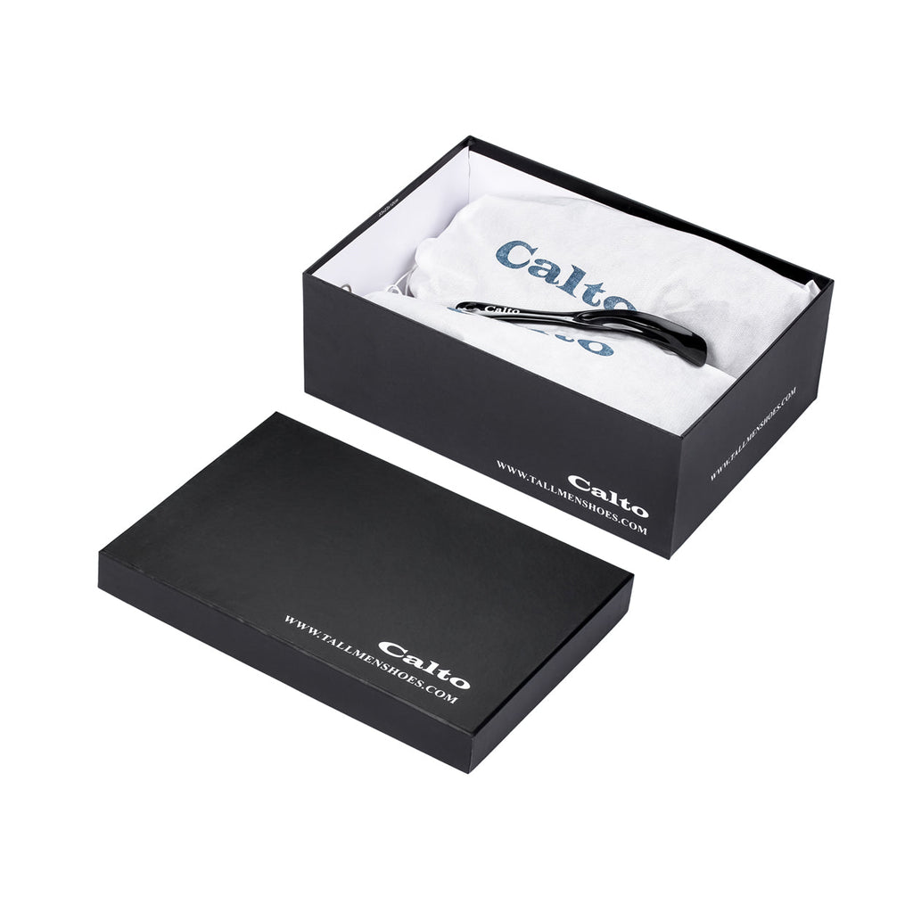 Black nubuck zipper boots in open shoe box with tissue wrap