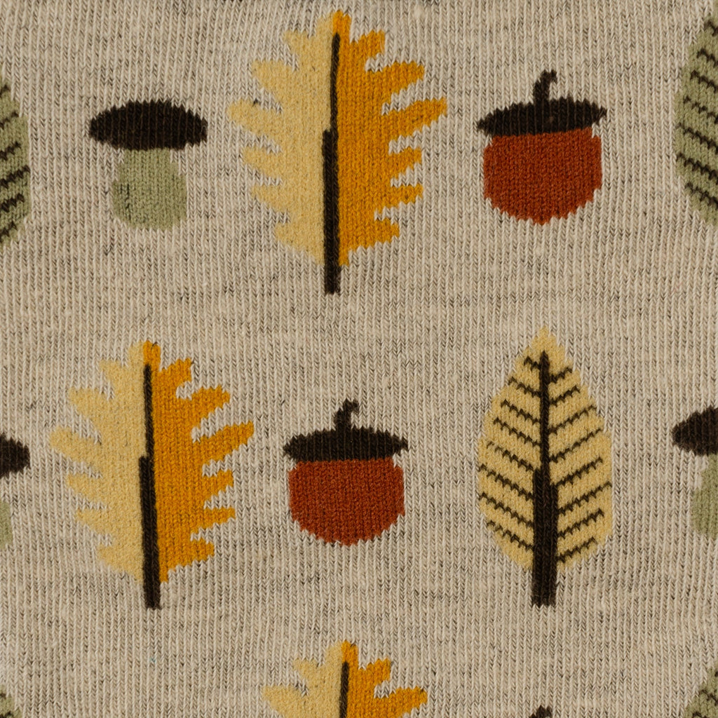 Men's crew sock pattern: tan knit with orange and brown autumn tree and acorn motifs
