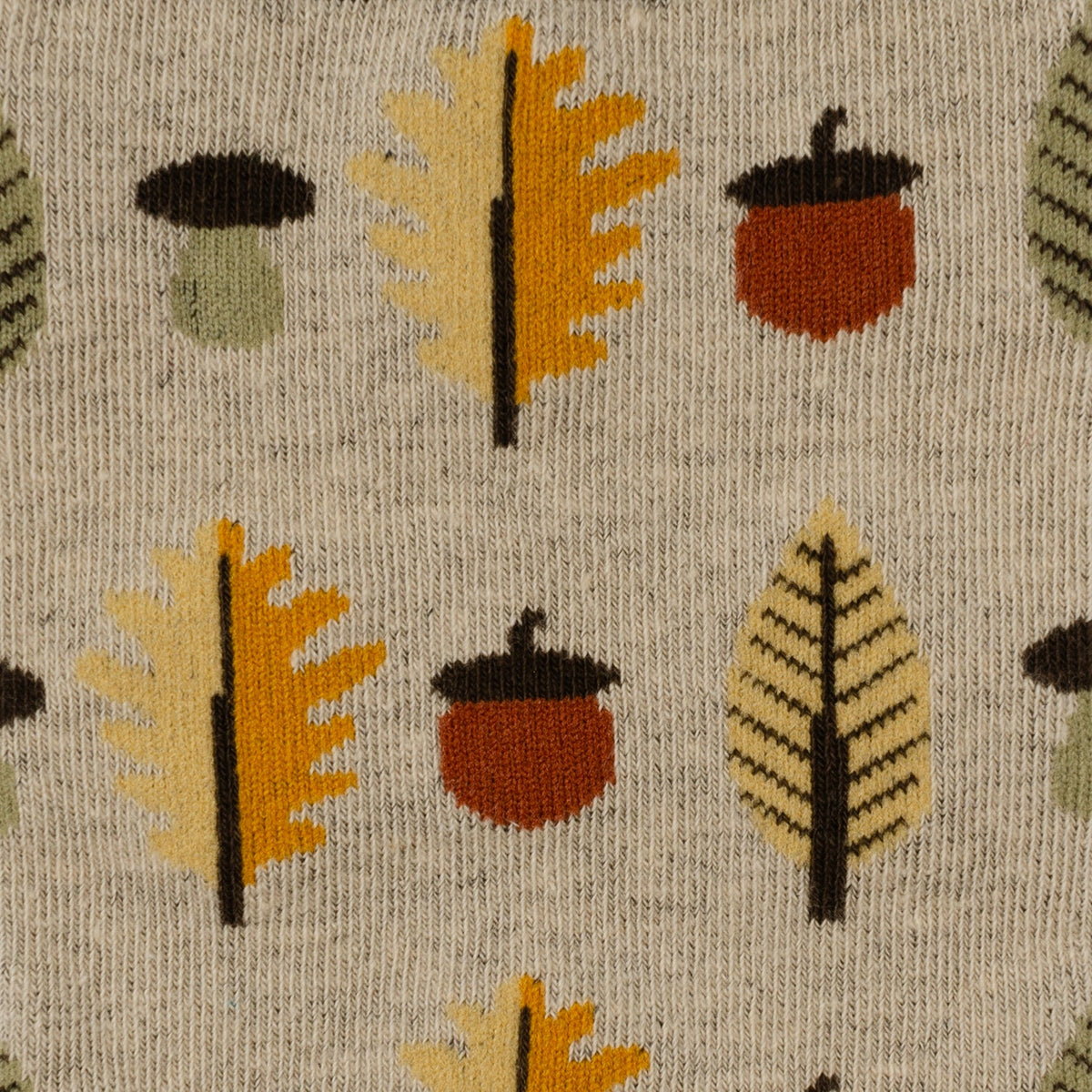 Men's crew sock pattern: tan knit with orange and brown autumn tree and acorn motifs